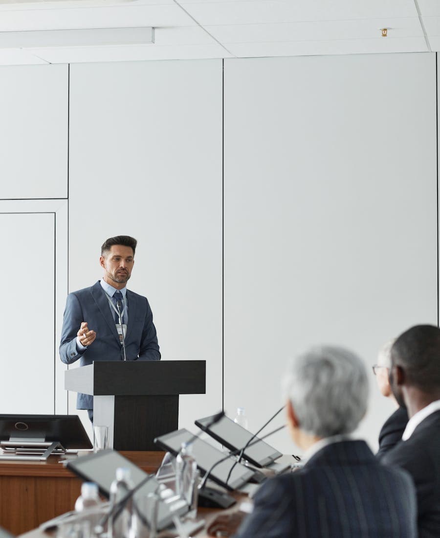 Agency leader presenting at a conference podium