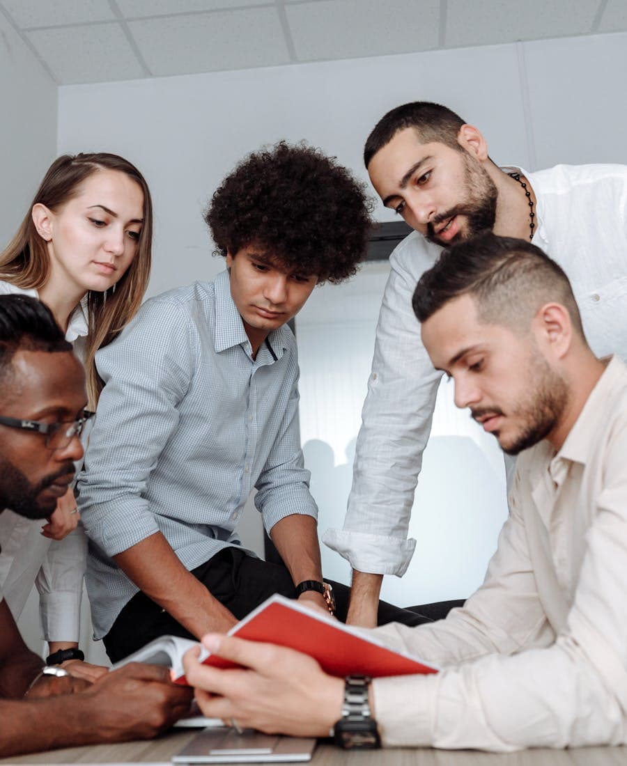 Multicultural team collaborating in a bright office space
