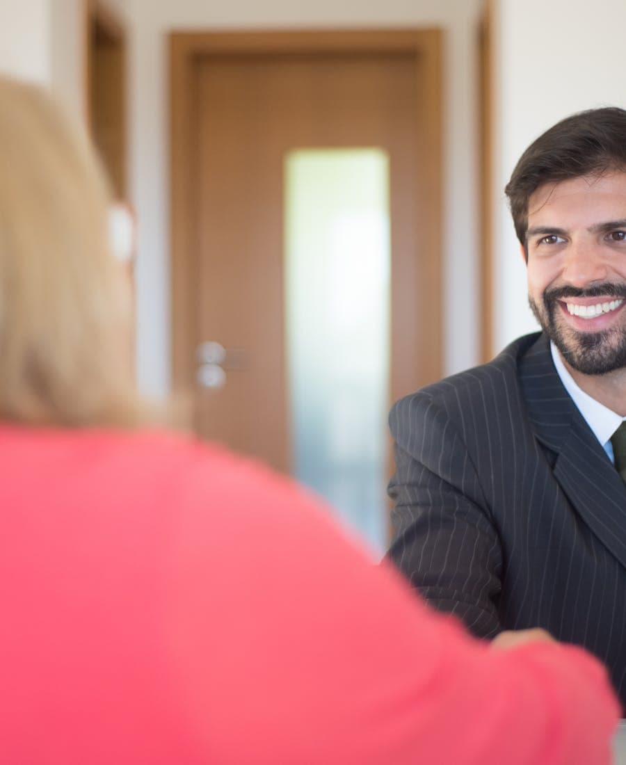 Smiling professional welcoming a customer to a PetaSight demo session