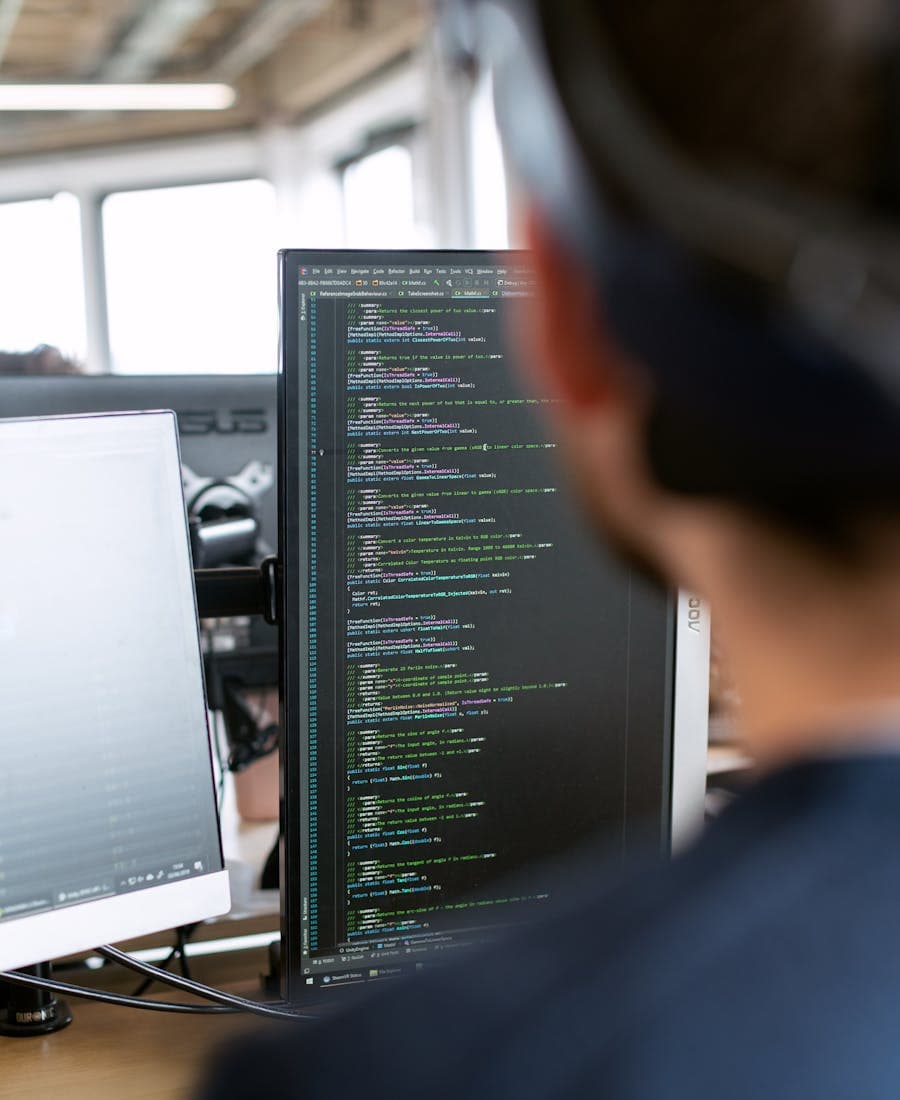 Software engineer writing code in a modern office