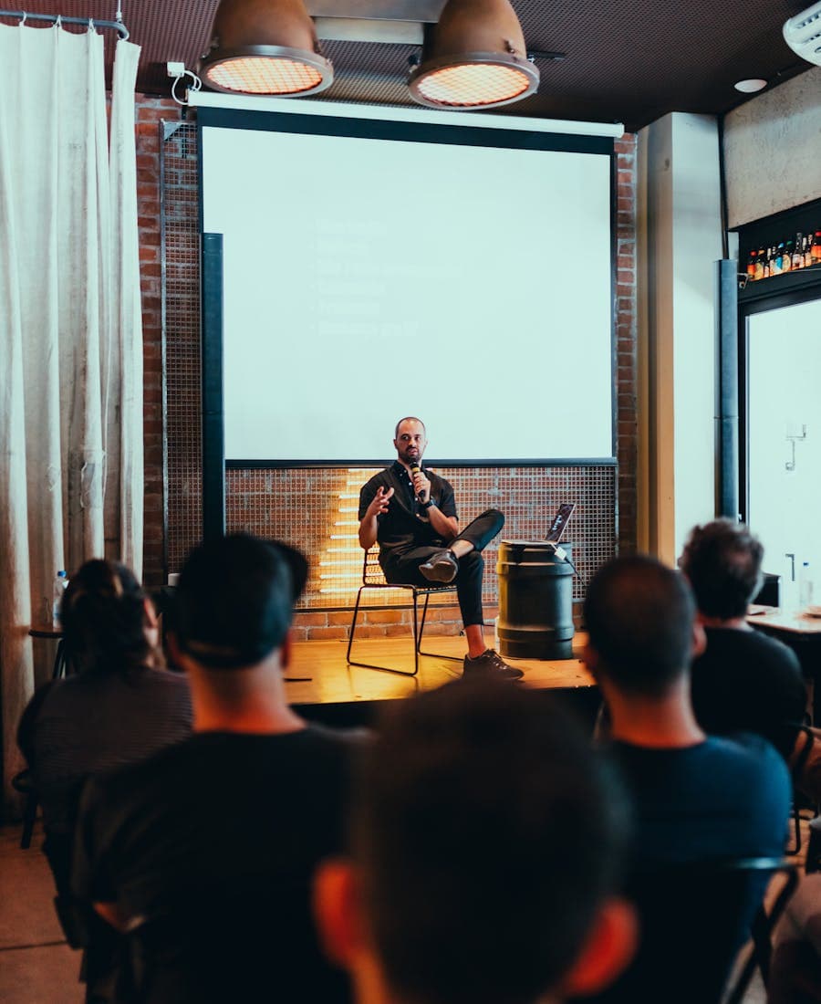 Speaker presenting a product demo to an engaged audience