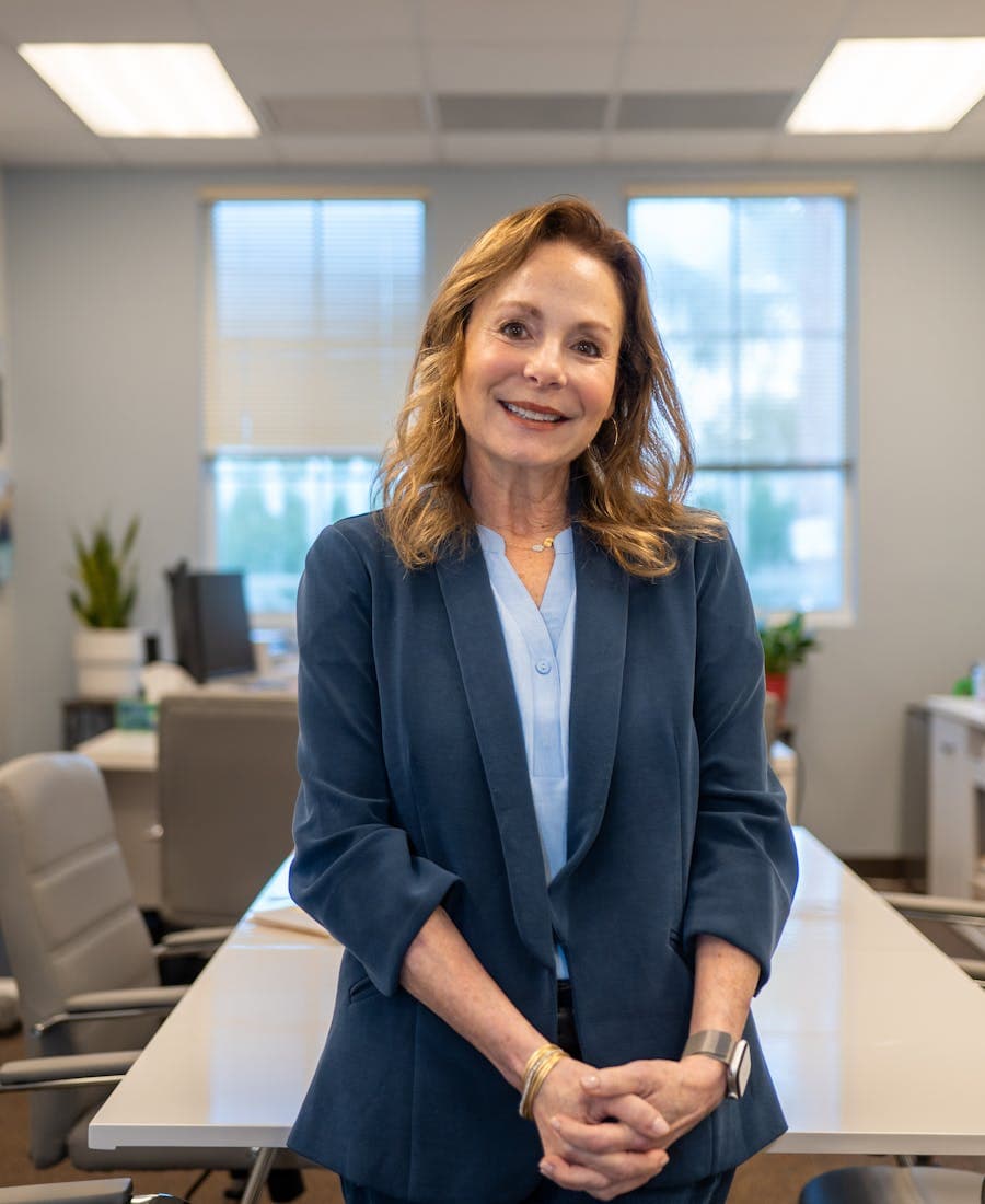 Confident compliance leader smiling in a modern office
